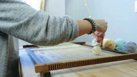 Weaving on a loom frame. Closeup woman's... | Stock Video | Pond5