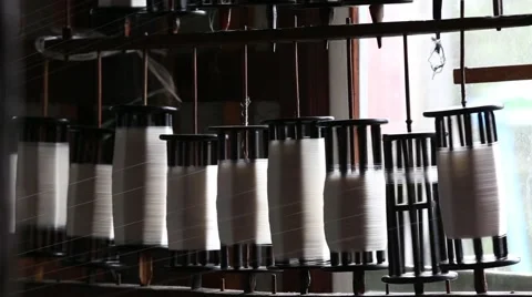 Weaving loom machines and spin yarn creating silk or cotton thread fiber Stock Footage 67756533