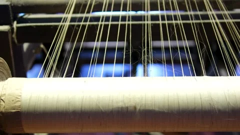 Weaving loom at a textile factory, closeup. industrial fabric production line Stock Footage 318215440