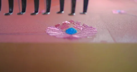 Weaving machine needle creating beautiful designs in silk sarees in slow motion Stock Footage 122408663