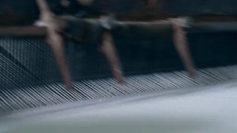 Weaving machine works with white fabric at a textile plant. Stock Footage 106752300