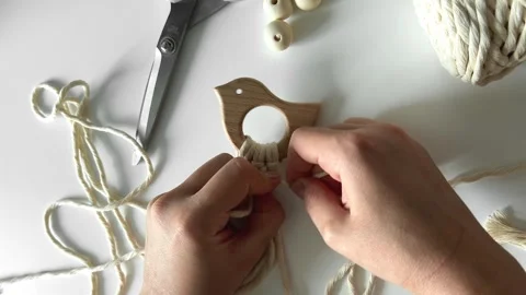 Weaving macrame. The girl weaves macrame. Hand-made. Stock Footage 245266399