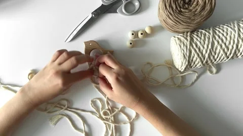 Weaving macrame. The girl weaves macrame. Hand-made. Stock Footage 245266400