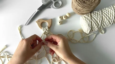 Weaving macrame. The girl weaves macrame. Hand-made. Stock Footage 245266401