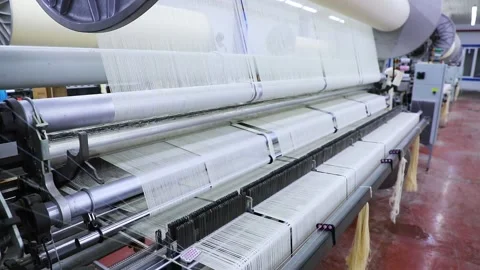 Weaving material on the machine Stock Footage 165041259