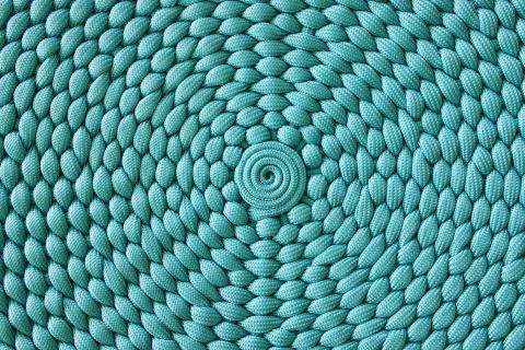 Weaving pattern with a center in a circle. Stock Photos