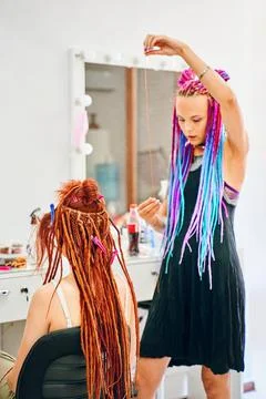 Weaving process with kanekalon. Stock Photos
