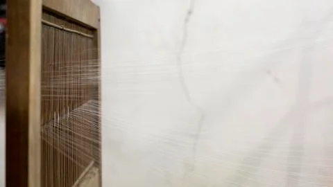 Weaving silk threads Stock-Fotos