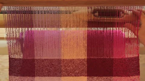 Weaving tea towels on a loom Stockbeeldmateriaal 11239957