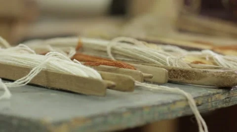 Weaving Threads On The Table 01 Stock Footage 62328212