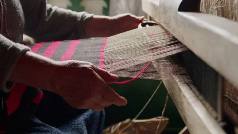 Weaving on a traditional old loom. Video stock 220366805