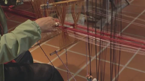 Weaving vibrant patterns in traditional textile craft Stock Footage 308835903