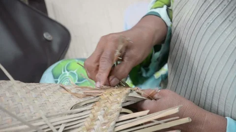 Weaving a wicker basket by handmade Stock Footage 86221938