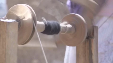 Weaving yarn on spinning wheel Stock Footage