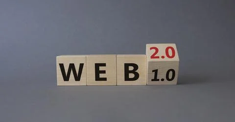 WEB 2 or 1 symbol. Turned wooden cubes with words WEB 1.0 or WEB 2.0. Beautif Stockfoto's