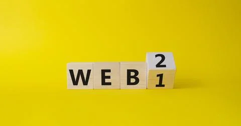 WEB 2 or 1 symbol. Turned wooden cubes with words WEB 1 and WEB 2. Beautifu.. Stockfoto's