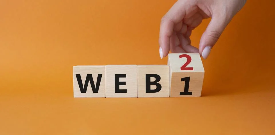 WEB 2 or WEB 1 symbol. Businessman hand Turnes cube and changes word SWEB 1.. Photos