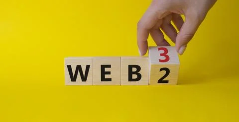 Web 3 vs Web 2 symbol. Businessman Hand turns cubes and changes the word we.. 스톡 사진