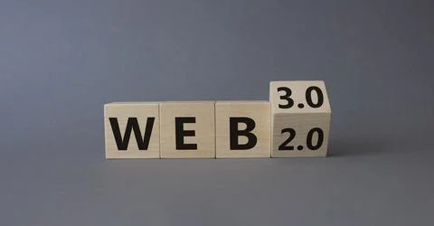Web 3.0 vs Web 2.0 symbol. Turned wooden cubes with words web 2.0 to web 3... Stockfoto's