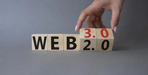 Web 3.0 vs Web 2.0 symbol. Hand turns cubes and changes the word web 3.0 to.. Photos