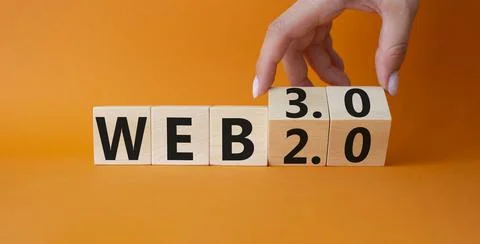 Web 3.0 vs Web 2.0 symbol. Hand turns cubes and changes the word web 3.0 to.. Stock Photos