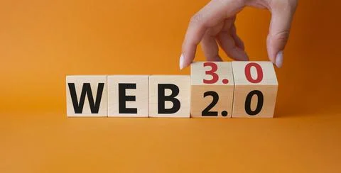 Web 3.0 vs Web 2.0 symbol. Hand turns cubes and changes the word web 3.0 to.. Photos
