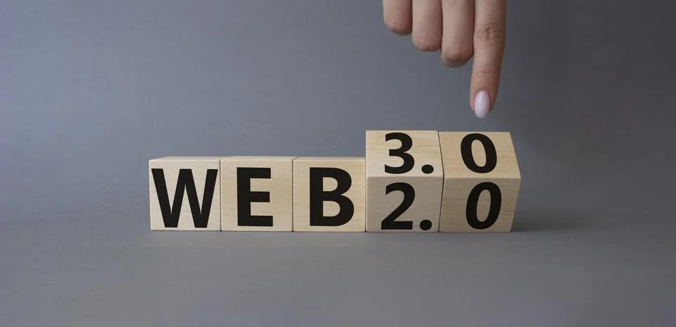 Web 3.0 vs Web 2.0 symbol. Finger points at cubes with the words web 3.0 an.. 写真素材