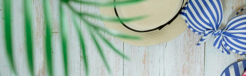 Web banner and flat lay summer time with swimsuit and beach accessories on vi Stock Photos