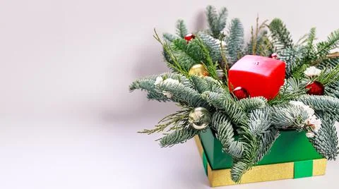 Web banner. Christmas composition with a red candle, fir branches and Christm Stock Photos