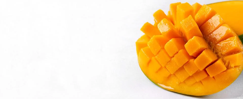 Web banner with mango cut into cubes on white Foto stock