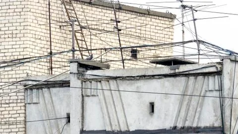 Web of Cable Wire Lines, TV Antennas on the Rooftop of a Building. Stock Photos