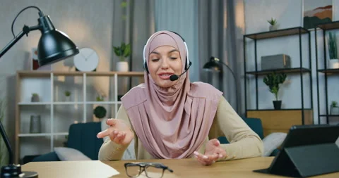 Web camera view of charming satisfied confident young arabic woman in hijab with Stock Footage 150161894