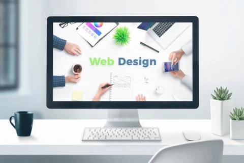 Web design studio concept. Desktop computer display on flat office desk. Clos Foto stock