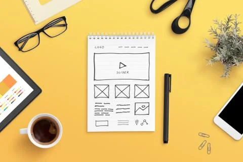 Web design studio concept with web site layout sketch on paper. Orange work d 스톡 사진