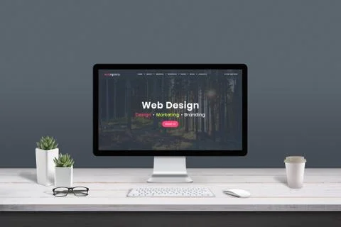 Web design studio concept. Work desk with computer display and modern design  Stock Photos