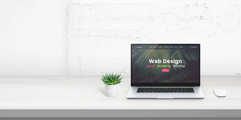 Web design studio promo web site concept on laptop display. Free space beside Stock Photos