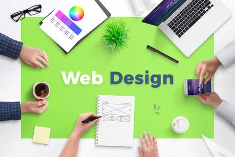 Web design text on office desk. Concept of web development team work space. F Stock Photos