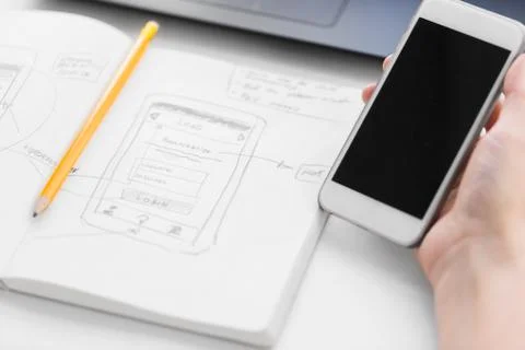 Web designer creating mobile user interface Foto stock
