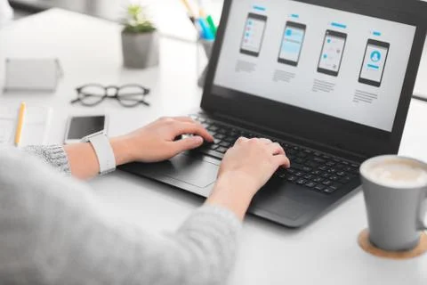 Web designer with laptop working on user interface 스톡 사진