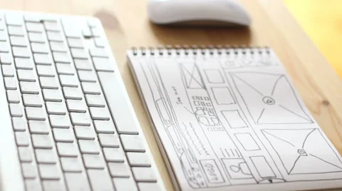 Web designer makes notes in a notebook Vídeo Stock 64046331