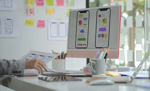 Web designer or developer planning application development draft sketch drawi Stock Photos