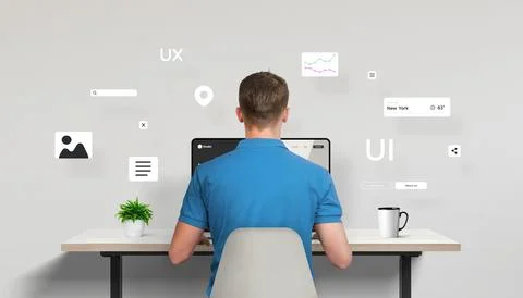 Web designer or developer seated in front of a laptop 库存照片