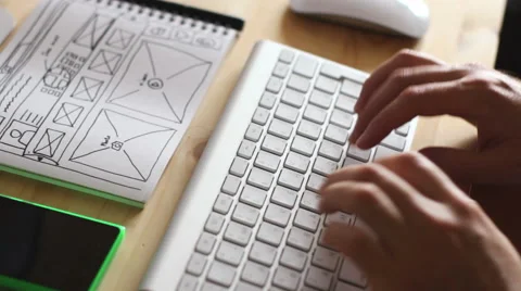 Web designer types on the keyboard Stockbeeldmateriaal 64046330