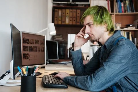 Web designer working on computer in office. Stock Photos