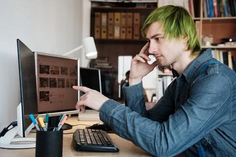 Web designer working on computer in office. Stock Photos