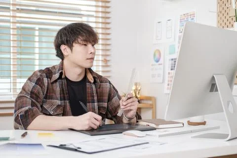 Web designer working on a new app design and planning application developme.. Stock Photos