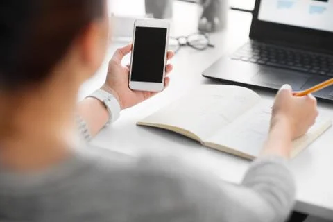 Web designer working on smartphone user interface Foto stock