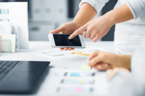 Web designers creating mobile user interface Stock Photos