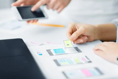 Web designers creating mobile user interface Stock Photos