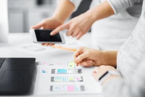Web designers creating mobile user interface Stock Photos